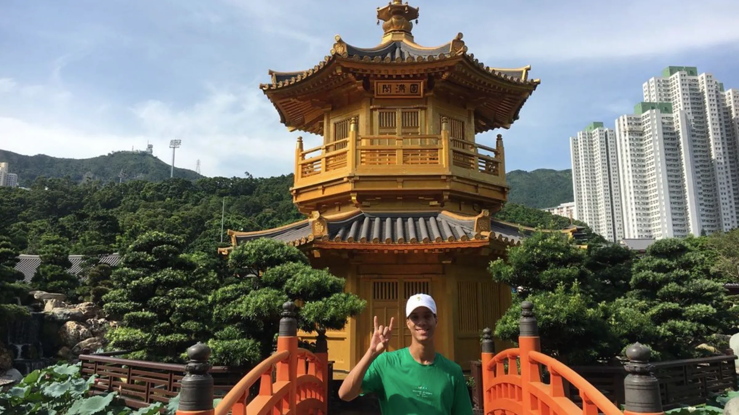 student in front of vermilion temple